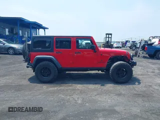 2014 Jeep Wrangler Unlimited Rubicon with VIN 1C4BJWFG0EL326979, listed as a IAAI auction lot 41913129 with 118,548 mi miles and . Bid and sale history available at DreamBid. Image 14.
