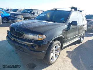 2004 BMW X5 4.4i with VIN 5UXFB53504LV06486, listed as a IAAI auction lot 41674534 with 164,974 mi miles. Bid and sale history available at carsss.com. Image 2.
