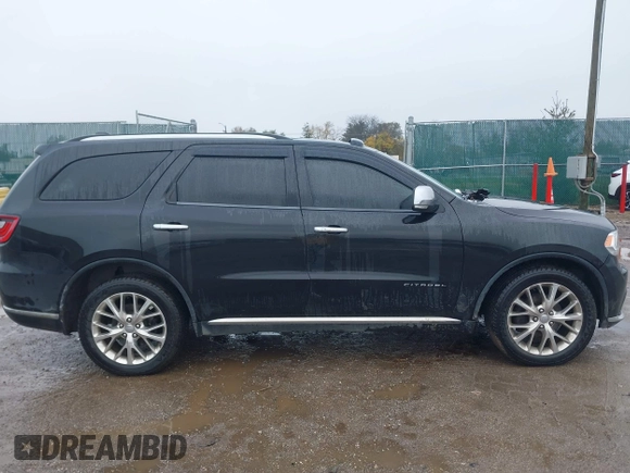 2014 Dodge Durango Citadel with VIN 1C4RDJEG5EC466164, listed as a IAAI auction lot 40936279 with 259,102 mi miles and . Bid and sale history available at DreamBid. Image 13.