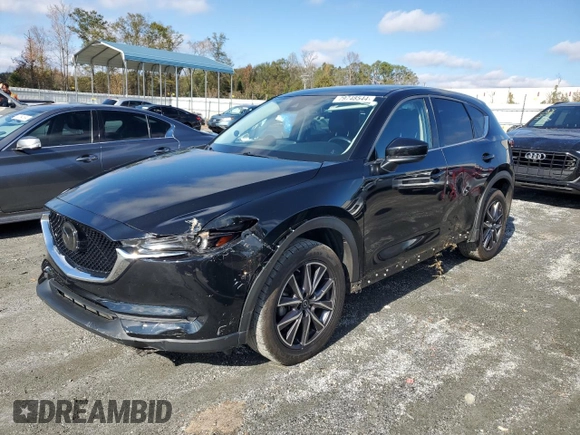 2018 Mazda CX-5 Grand Touring with VIN JM3KFADM5J0325794, listed as a Copart auction lot 79748544 with 106,781 mi miles and Salvage Title. Bid and sale history available at carsss.com. Image 1.
