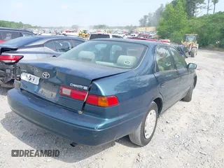 1997 Toyota Camry LE z VIN 4T1BG22K2VU778245, wystawiony jako IAAI lot #42145592 z przebiegiem 276 611 mil mil oraz . Historia ofert i sprzedaży dostępna na DreamBid. Obrazek 4.