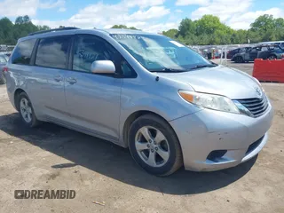 2014 Toyota Sienna LE AAS with VIN 5TDKK3DC9ES489463, listed as a IAAI auction lot 42344427 with 233,265 mi miles and . Bid and sale history available at DreamBid. Image 1.