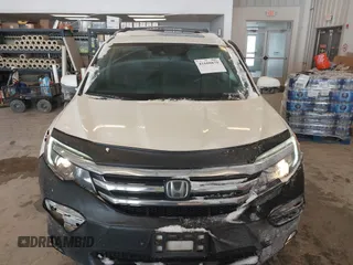 2017 Honda Pilot Touring with VIN 5FNYF6H92HB032873, listed as a IAAI auction lot 41608870 with 123,888 mi miles. Bid and sale history available at carsss.com. Image 12.