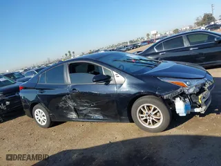 2021 Toyota Prius L Eco with VIN JTDKAMFU1M3134107, listed as a IAAI auction lot 41763080 with 185,248 mi miles. Bid and sale history available at carsss.com. Image 14.
