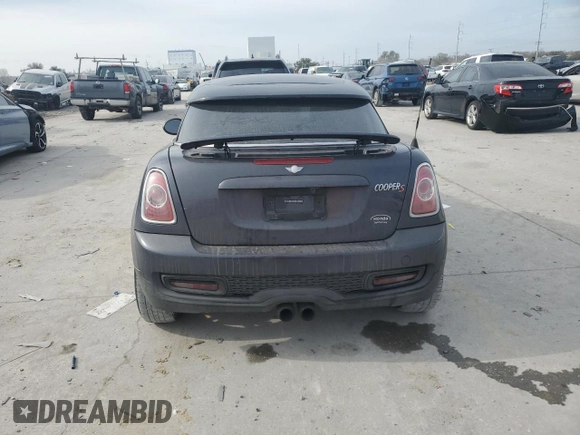 2014 MINI Coupe S z VIN WMWSX3C59ET773064, wystawiony jako Copart lot #42989015 z przebiegiem 135 005 mil mil oraz Szkoda całkowita • Salvage title. Historia ofert i sprzedaży dostępna na DreamBid. Obrazek 6.