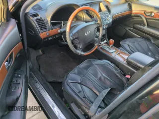 2003 Infiniti Q45 z VIN JNKBF01A73M102745, wystawiony jako Copart lot #75193194 z przebiegiem Nie podano mil oraz Nie do naprawy. Historia ofert i sprzedaży dostępna na DreamBid. Obrazek 8.
