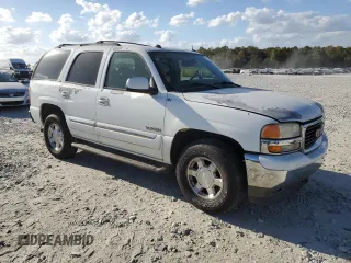 2005 GMC Yukon SLE with VIN 1GKEC13T15J230550, listed as a Copart auction lot 77214624 with 203,095 mi miles and Salvage Title. Bid and sale history available at carsss.com. Image 4.