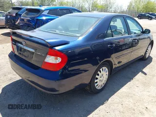 2003 Toyota Camry LE with VIN 4T1BE32K13U204938, listed as a IAAI auction lot 42194548 with 263,710 mi miles and . Bid and sale history available at DreamBid. Image 4.