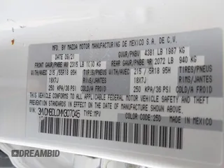 2021 Mazda CX-30 Premium with VIN 3MVDMBDL0MM307045, listed as a IAAI auction lot 42446494 with 33,112 mi miles and . Bid and sale history available at DreamBid. Image 9.