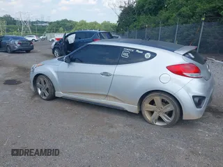 2013 Hyundai Veloster Turbo with VIN KMHTC6AE1DU177023, listed as a IAAI auction lot 42604617 with 102,087 mi miles and . Bid and sale history available at DreamBid. Image 3.