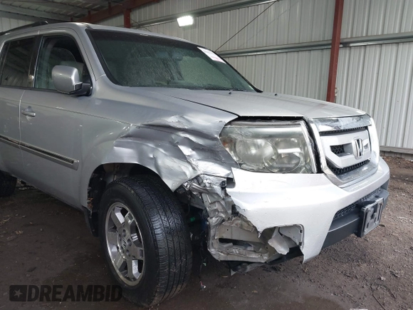 2011 Honda Pilot Touring with VIN 5FNYF4H90BB084692, listed as a IAAI auction lot 41867622 with 62,805 mi miles. Bid and sale history available at carsss.com. Image 6.