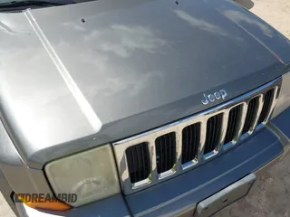 2007 Jeep Commander Sport z VIN 1J8HG48P87C647870, wystawiony jako IAAI lot #42185954 z przebiegiem 269 402 mil mil oraz . Historia ofert i sprzedaży dostępna na DreamBid. Obrazek 6.