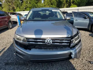 2021 Volkswagen Tiguan S with VIN 3VV1B7AX9MM023655, listed as a Copart auction lot 64159445 with 55,795 mi miles and Salvage title. Bid and sale history available at DreamBid. Image 5.