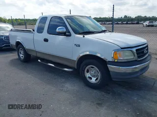 2002 Ford F-150 XL with VIN 1FTRX17242NA69697, listed as a IAAI auction lot 42038258 with 207,008 mi miles. Bid and sale history available at carsss.com. Image 1.