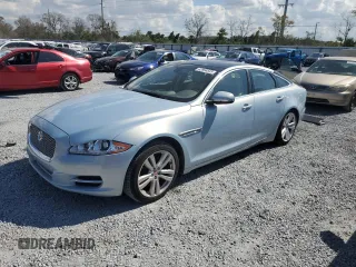 2014 Jaguar XJ with VIN SAJWA1CZ4E8V71167, listed as a Copart auction lot 43994545 with 69,682 mi miles and Salvage Title. Bid and sale history available at DreamBid. Image 1.