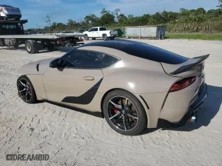 2022 Toyota GR Supra 3.0 with VIN WZ1DB0C0XNW051907, listed as a Copart auction lot 70628834 with 23,012 mi miles and Salvage Title. Bid and sale history available at carsss.com. Image 2.