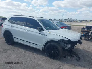 2022 Volkswagen Tiguan SE R-Line Black with VIN 3VVCB7AX5NM040222, listed as a IAAI auction lot 42073998 with 36,225 mi miles and . Bid and sale history available at DreamBid. Image 1.