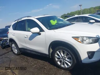 2014 Mazda CX-5 Grand Touring with VIN JM3KE2DY1E0424890, listed as a IAAI auction lot 42052437 with 107,793 mi miles. Bid and sale history available at carsss.com. Image 13.