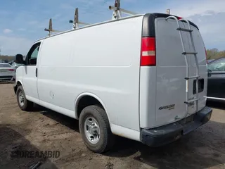 2014 Chevrolet Express Cargo Van with VIN 1GCWGFCA7E1110011, listed as a IAAI auction lot 41983301 with 114,827 mi miles. Bid and sale history available at carsss.com. Image 3.