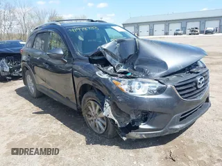 2016 Mazda CX-5 Touring with VIN JM3KE4CYXG0620990, listed as a IAAI auction lot 41978738 with 91,237 mi miles and . Bid and sale history available at carsss.com. Image 1.