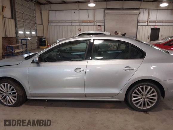 2012 Volkswagen Jetta Sedan SEL w/Sunroof with VIN 3VWLX7AJ4CM344390, listed as a IAAI auction lot 41439880 with 220,093 mi miles. Bid and sale history available at carsss.com. Image 14.