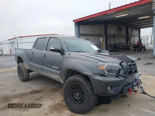 2014 Toyota Tacoma z VIN 3TMMU4FN9EM066292, wystawiony jako IAAI lot #41542492 z przebiegiem 122 308 mil mil oraz . Historia ofert i sprzedaży dostępna na DreamBid. Obrazek 1.