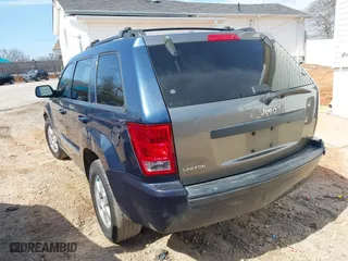 2010 Jeep Grand Cherokee Laredo with VIN 1J4PS4GK0AC112654, listed as a IAAI auction lot 41809445 with 418,301 mi miles. Bid and sale history available at carsss.com. Image 3.