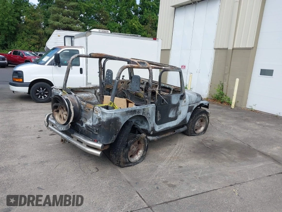 2000 Jeep Wrangler Sport with VIN 1J4FA49S5YP797345, listed as a IAAI auction lot 40322775 with Not Provided miles and . Bid and sale history available at DreamBid. Image 4.