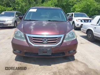 2010 Honda Odyssey Touring z VIN 5FNRL3H92AB010292, wystawiony jako IAAI lot #42469216 z przebiegiem 188 921 mil mil oraz . Historia ofert i sprzedaży dostępna na DreamBid. Obrazek 6.