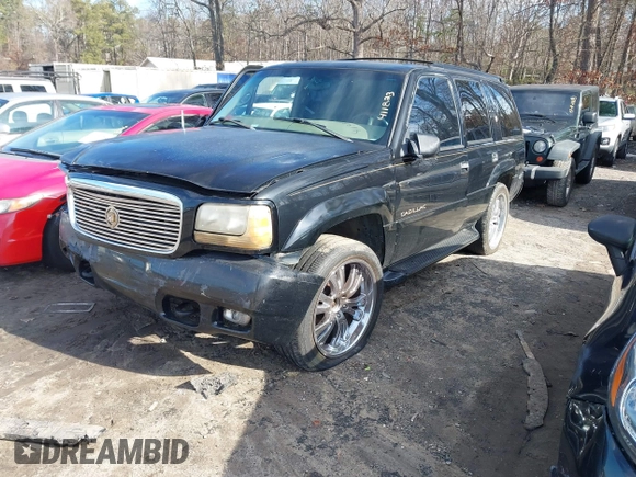 1999 Cadillac Escalade z VIN 1GYEK13R4XR411823, wystawiony jako IAAI lot #41221246 z przebiegiem 184 123 mil mil oraz . Historia ofert i sprzedaży dostępna na DreamBid. Obrazek 2.