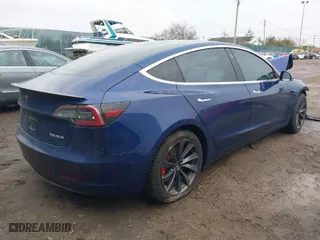 2018 Tesla Model 3 Long Range Battery with VIN 5YJ3E1EB2JF180275, listed as a IAAI auction lot 41196064 with 110,535 mi miles. Bid and sale history available at carsss.com. Image 4.