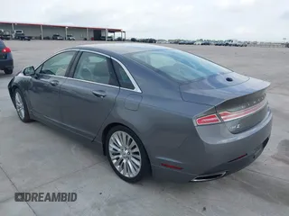 2014 Lincoln MKZ z VIN 3LN6L2G99ER834840, wystawiony jako IAAI lot #42134656 z przebiegiem 33 565 mil mil oraz . Historia ofert i sprzedaży dostępna na DreamBid. Obrazek 3.