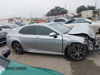 2019 Toyota Camry LE z VIN 4T1B11HK7KU713082, wystawiony jako IAAI lot #42151362 z przebiegiem 93 546 mil mil oraz . Historia ofert i sprzedaży dostępna na DreamBid. Obrazek 14.