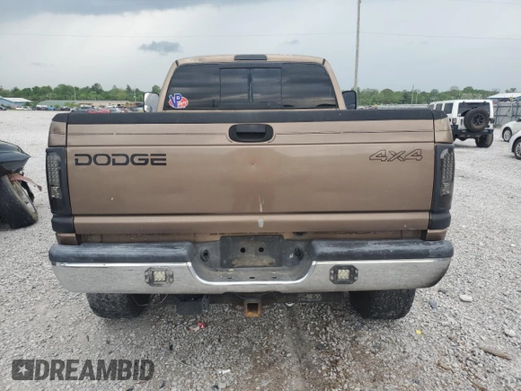 2001 Dodge 2500 z VIN 3B7KF23611G707673, wystawiony jako Copart lot #54608365 z przebiegiem 286 072 mil mil oraz Szkoda całkowita • Salvage title. Historia ofert i sprzedaży dostępna na DreamBid. Obrazek 6.