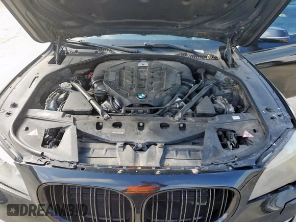 2014 BMW 7 Series 750i с VIN WBAYA8C57ED824970, выставлен на аукционе Copart как лот 61005925 с пробегом 144 457 миль миль и Чистый • Clean title. История ставок и продаж доступна на DreamBid. Изображение 11.