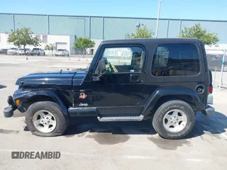 2001 Jeep Wrangler Sahara z VIN 1J4FA59S41P313113, wystawiony jako IAAI lot #42266173 z przebiegiem 125 792 mil mil oraz . Historia ofert i sprzedaży dostępna na DreamBid. Obrazek 14.