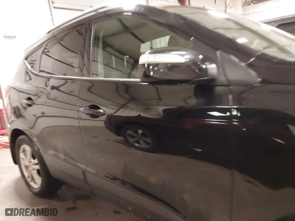 2013 Hyundai Tucson GLS with VIN KM8JU3AC0DU754948, listed as a IAAI auction lot 41811891 with 139,056 mi miles. Bid and sale history available at carsss.com. Image 13.