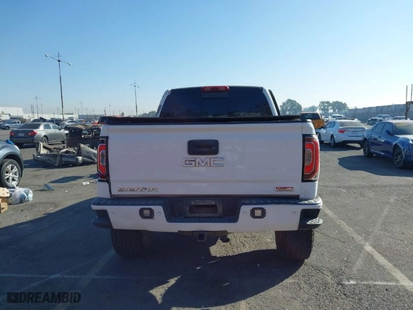2016 GMC Sierra 1500 SLT with VIN 3GTU2NEC2GG244329, listed as a IAAI auction lot 40810002 with 121,716 mi miles. Bid and sale history available at carsss.com. Image 16.