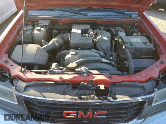 2012 GMC Canyon z VIN 1GTH5PFE6C8113599, wystawiony jako Copart lot #84532964 z przebiegiem 139 011 mil mil oraz Szkoda całkowita • Salvage title. Historia ofert i sprzedaży dostępna na DreamBid. Obrazek 11.