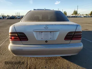 2002 Mercedes-Benz E-Class with VIN WDBJF65J32B496411, listed as a Copart auction lot 75690884 with 128,855 mi miles and Salvage Title. Bid and sale history available at carsss.com. Image 6.