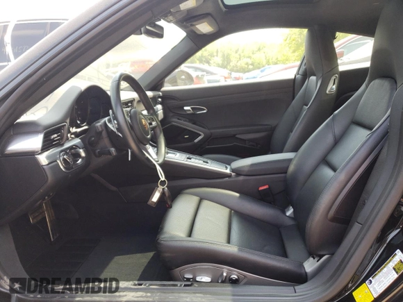 2018 Porsche 911 Carrera z VIN WP0AA2A93JS106166, wystawiony jako Copart lot #51105893 z przebiegiem 11 476 mil mil oraz . Historia ofert i sprzedaży dostępna na DreamBid. Obrazek 7.