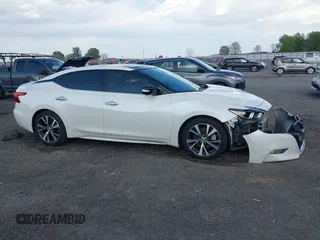 2016 Nissan Maxima SV z VIN 1N4AA6AP9GC431466, wystawiony jako IAAI lot #42007934 z przebiegiem 263 333 mil mil oraz . Historia ofert i sprzedaży dostępna na DreamBid. Obrazek 13.
