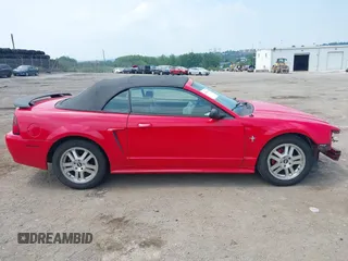 2003 Ford Mustang Deluxe z VIN 1FAFP44433F452977, wystawiony jako IAAI lot #42598309 z przebiegiem 99 596 mil mil oraz . Historia ofert i sprzedaży dostępna na DreamBid. Obrazek 13.