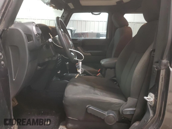 2017 Jeep Wrangler Willys Wheeler with VIN 1C4AJWAG9HL696710, listed as a Copart auction lot 88744905 with 66,800 mi miles and Salvage Title. Bid and sale history available at DreamBid. Image 7.