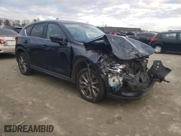 2020 Mazda CX-5 Grand Touring with VIN JM3KFADM4L1783968, listed as a Copart auction lot 85994244 with 89,074 mi miles and Salvage Title. Bid and sale history available at DreamBid. Image 4.