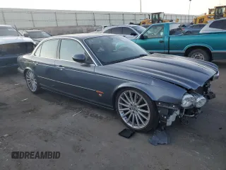 2004 Jaguar XJ with VIN SAJWA73B64TG30921, listed as a Copart auction lot 71267074 with 20,031 mi miles and Salvage Title. Bid and sale history available at carsss.com. Image 4.
