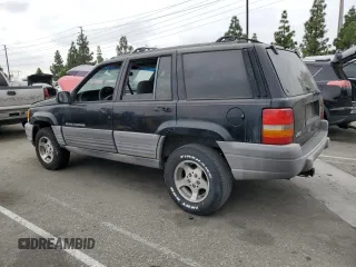 1998 Jeep Grand Cherokee Laredo with VIN 1J4FX58S0WC305329, listed as a Copart auction lot 76777264 with 251,942 mi miles and Clean Title. Bid and sale history available at carsss.com. Image 2.