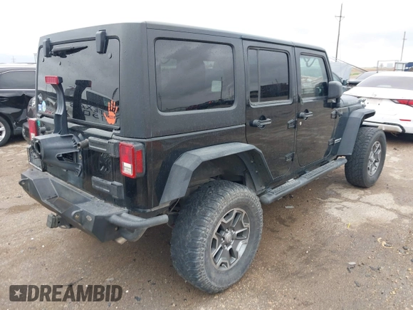 2012 Jeep Wrangler Unlimited Rubicon with VIN 1C4HJWFGXCL142804, listed as a IAAI auction lot 42183960 with 124,392 mi miles and . Bid and sale history available at DreamBid. Image 4.