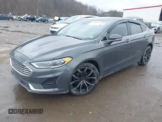 2019 Ford Fusion SEL with VIN 3FA6P0CD6KR141832, listed as a IAAI auction lot 41800102 with 142,282 mi miles and . Bid and sale history available at DreamBid. Image 23.