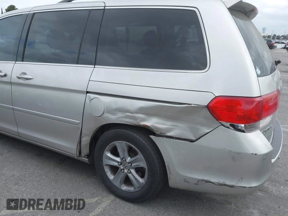 2008 Honda Odyssey Touring with VIN 5FNRL38908B058867, listed as a IAAI auction lot 42126471 with 201,088 mi miles and . Bid and sale history available at DreamBid. Image 6.